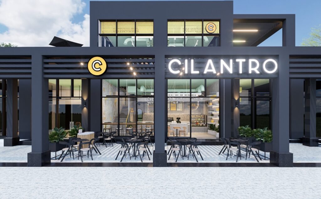 Cilantro cafe facade with a framed entrance, outdoor seating and visible illuminated signage