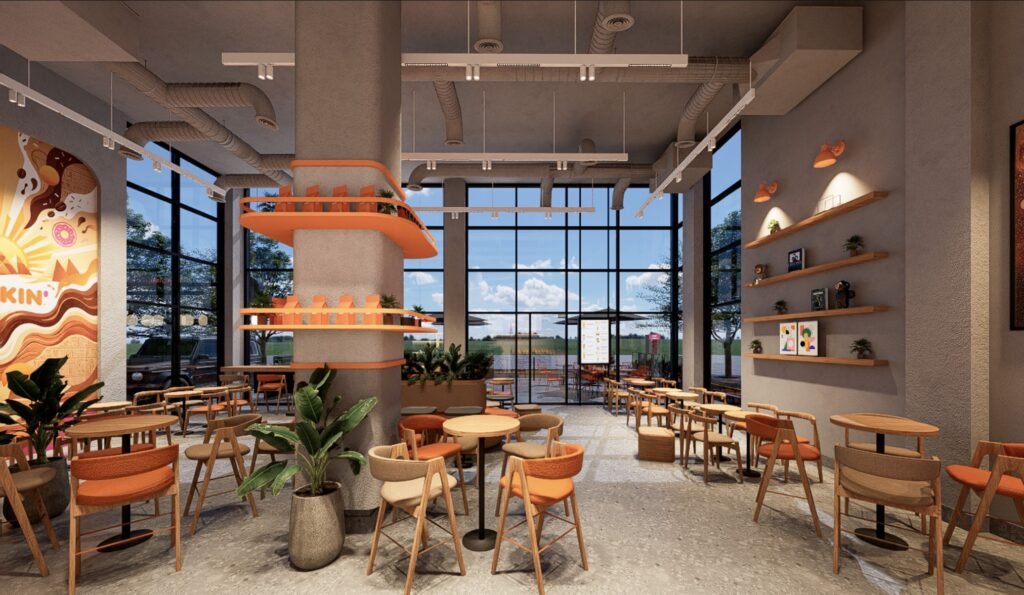 Dunkin restaurant interior with orange brand details, exposed services and flexible seating
